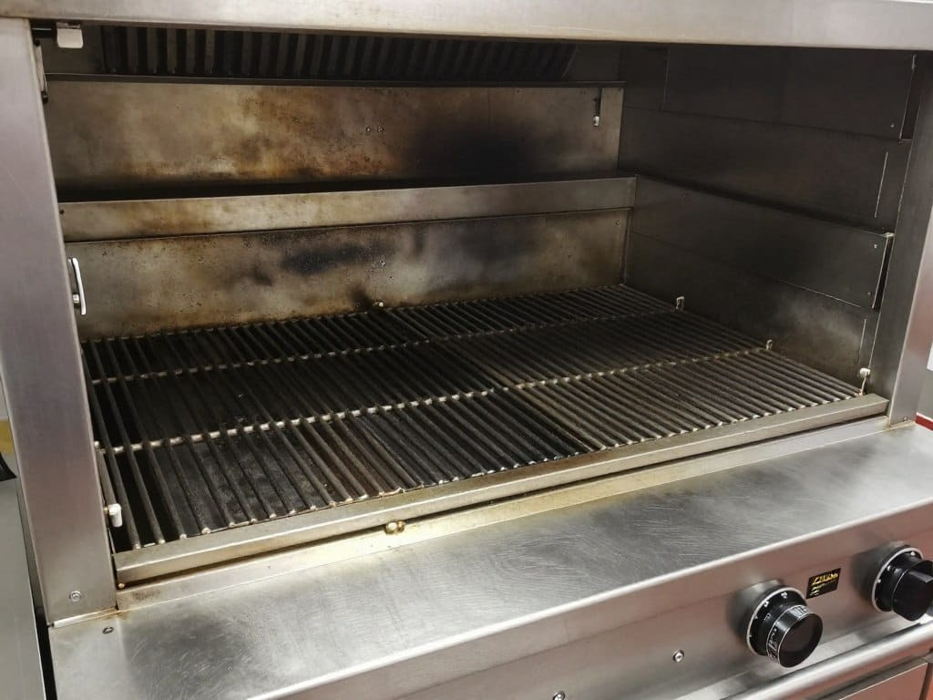 Z Grills 7002E cooking chamber showing porcelain-coated grates Z Grills 7002E cooking chamber showing porcelain-coated grates